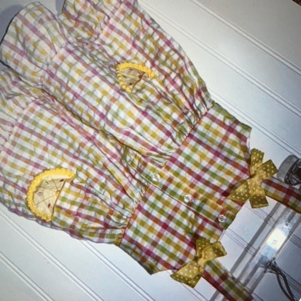 Vibrant checkered pattern with charming baby girl dress